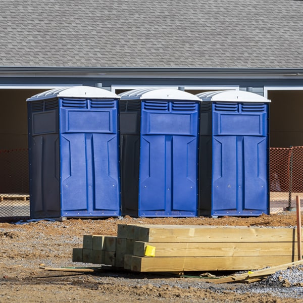 what is the cost difference between standard and deluxe portable restroom rentals in Smith Corner